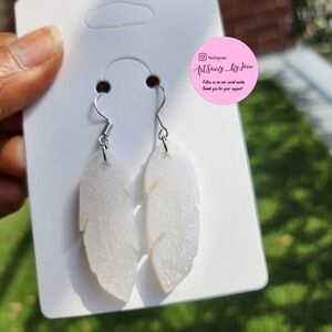 WHITE feather shaped earrings